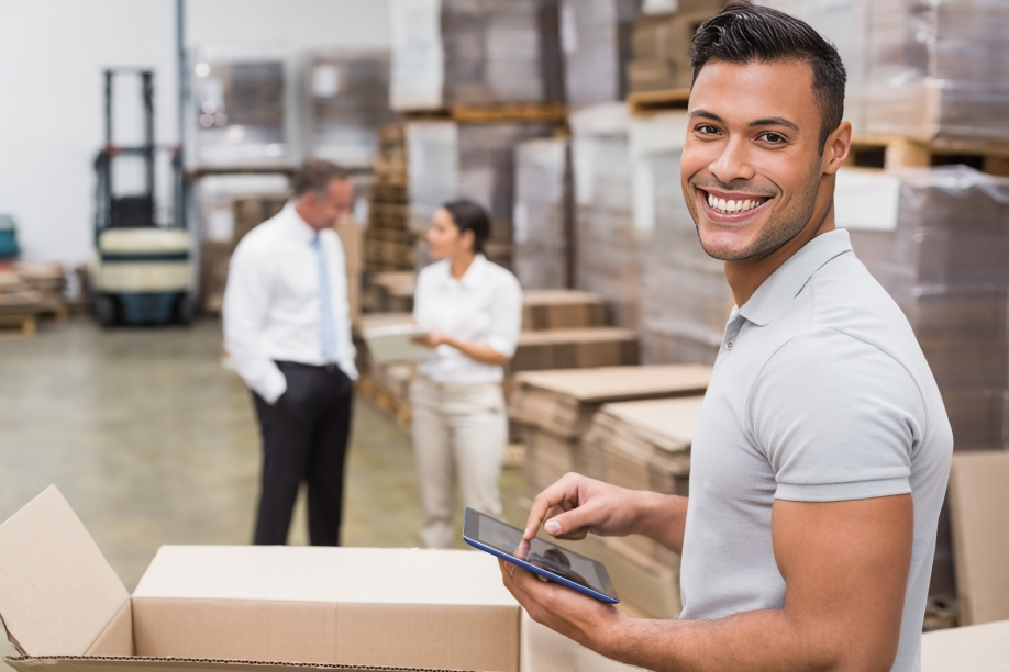 smiling manager using digital tablet