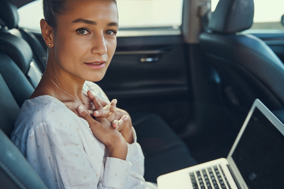 surprised female passenger with laptop in automobi 2021 09 04 11 40 52 utc