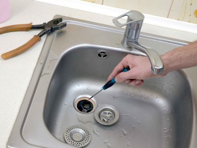 close-up-of-handsome-plumber-repairing-drain-of-ki-2023-11-27-04-58-12-utc_11zon